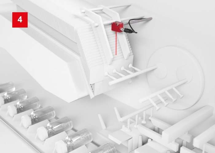 Lichttaster HT25 mit IO-Link für Formatumstellung zur Anwesenheitskontrolle an Kartonaufrichter